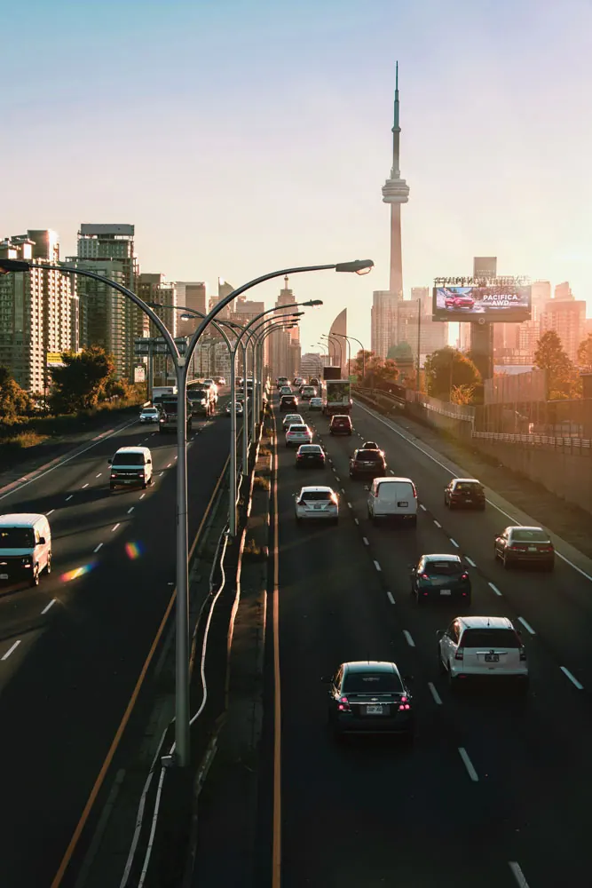 Traffic heading toward the CN Tower at sunset
