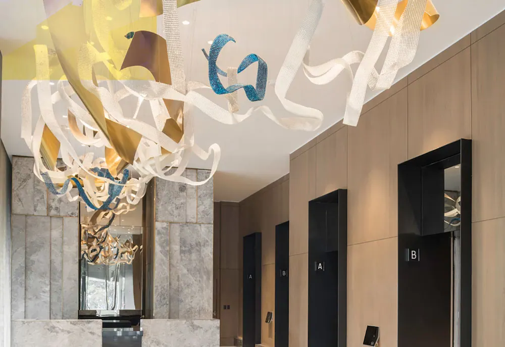Elevator lobby at The Ritz-Carlton Mexico City with a sculptural ribbon chandelier